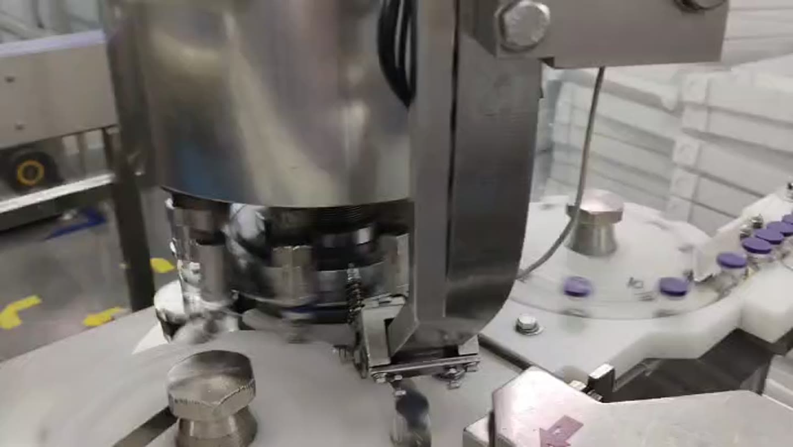 Stainless steel vial-capping machine on Vialdyne production line